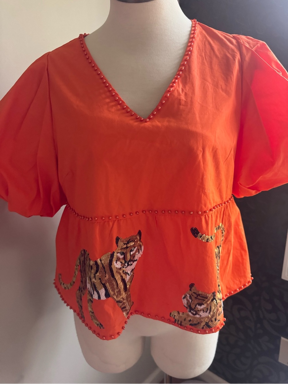 Queen of Sparkles Orange Embellished V-Neck Puff Sleeve Top with Tiger sequins